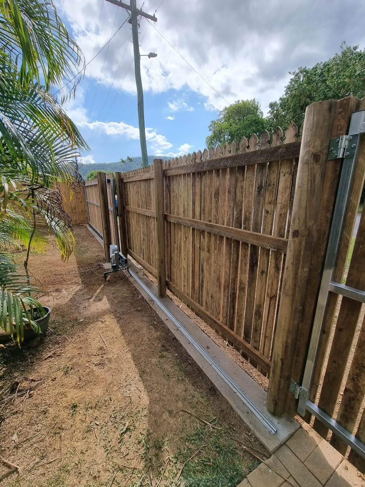Paling fence with sliding gate