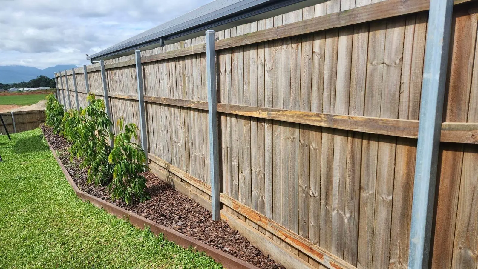 Paling fence with steel posts and new garden bed